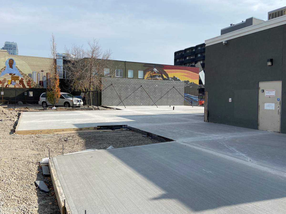 The mural blocked by the brick wall on 17th Avenue in Calgary.