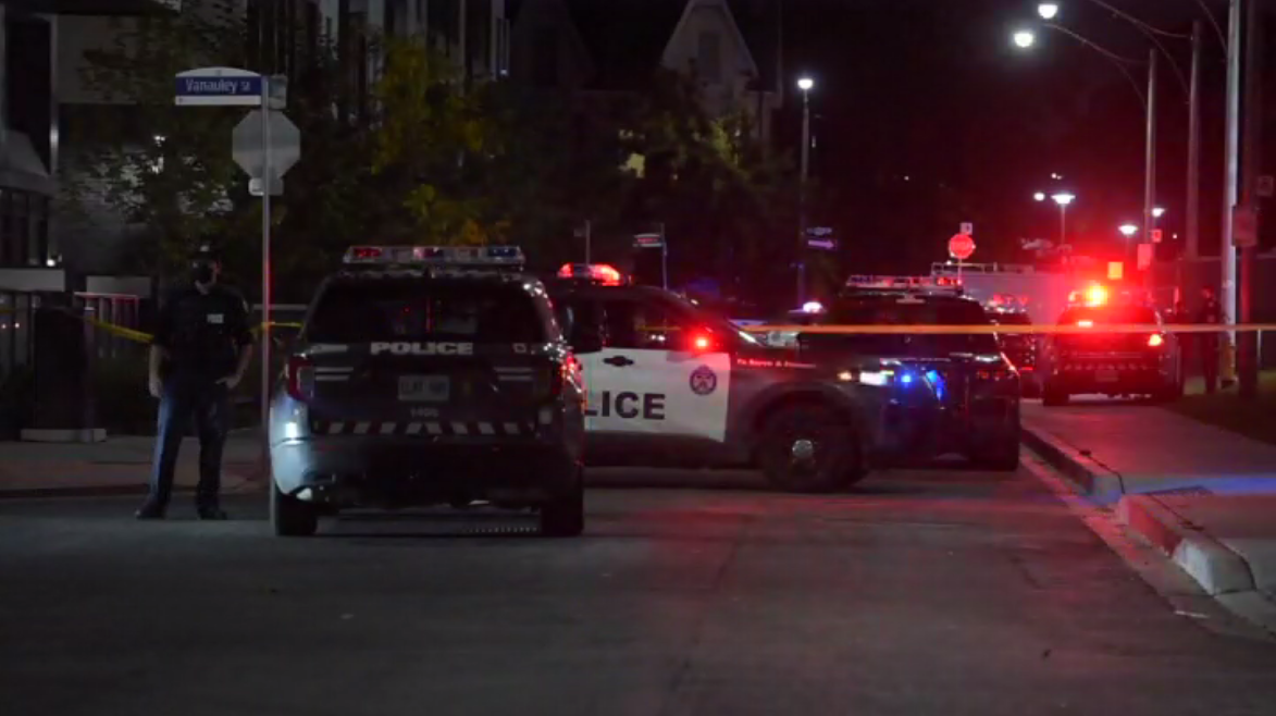 Police at the scene of the shooting near Spadina Avenue and Dundas Street on Sunday.