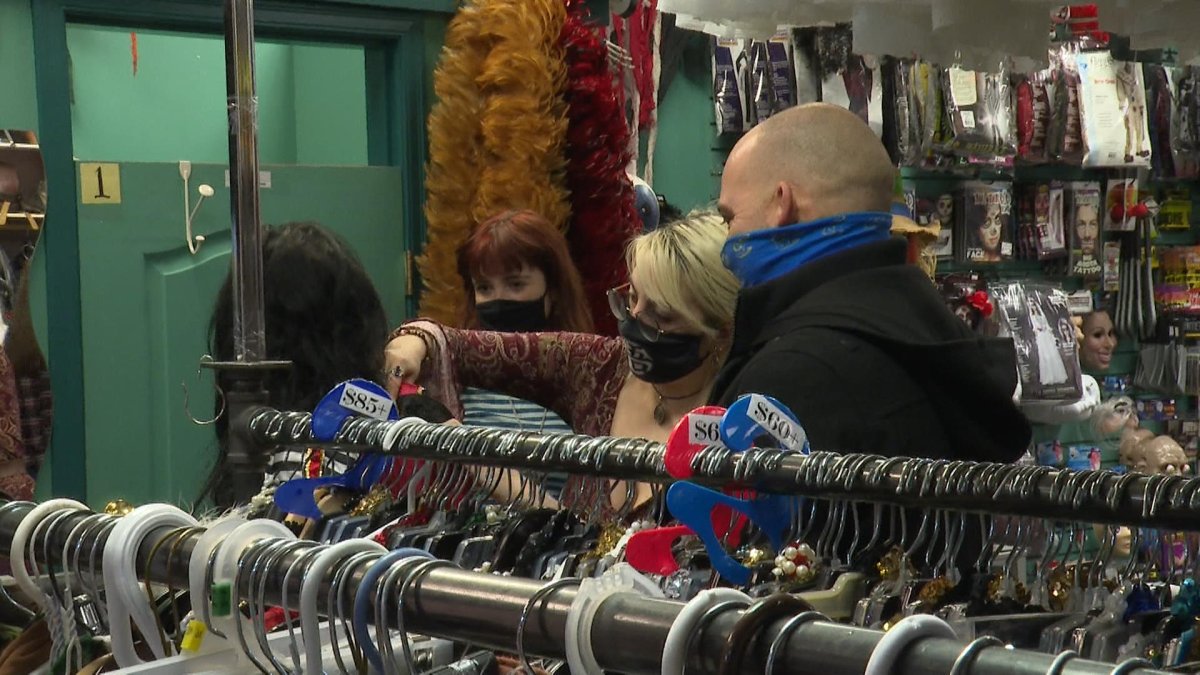 Customers at Calowna Costume in B.C. being styled in the rentals section for their Halloween costumes.