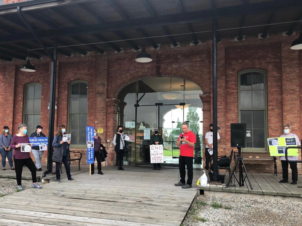 Around 17 people gathered outside MPP, Jeff Yurek’s office in St. Thomas to advocate for changes to long-term care on Oct. 4, 2021.