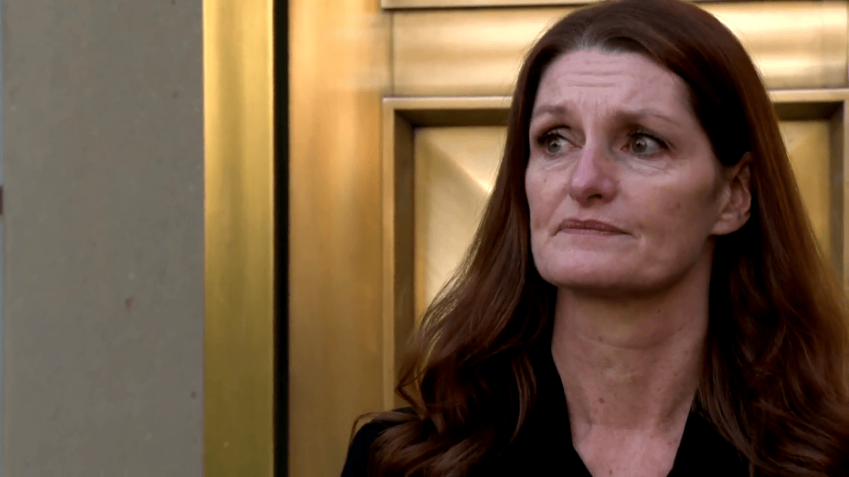 Kim Blankert, Lovett’s mom, outside the Calgary Courts Centre on Tuesday, Oct. 12, 2021.