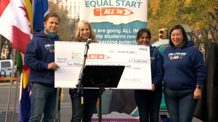 Pat Boot and Catherine Weenk (left), present SPSF representatives (from left to right) Zeba Ahmad and Stephanie Yong with a cheque for $2.25 million.