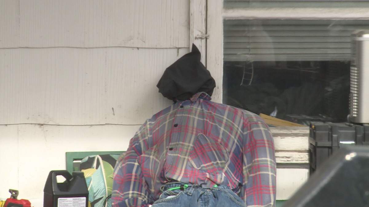 The male figure, which was spotted hanging from a tree by a noose, had been taken down when a Global News crew arrived at the home on Wednesday, Oct. 27, 2021.