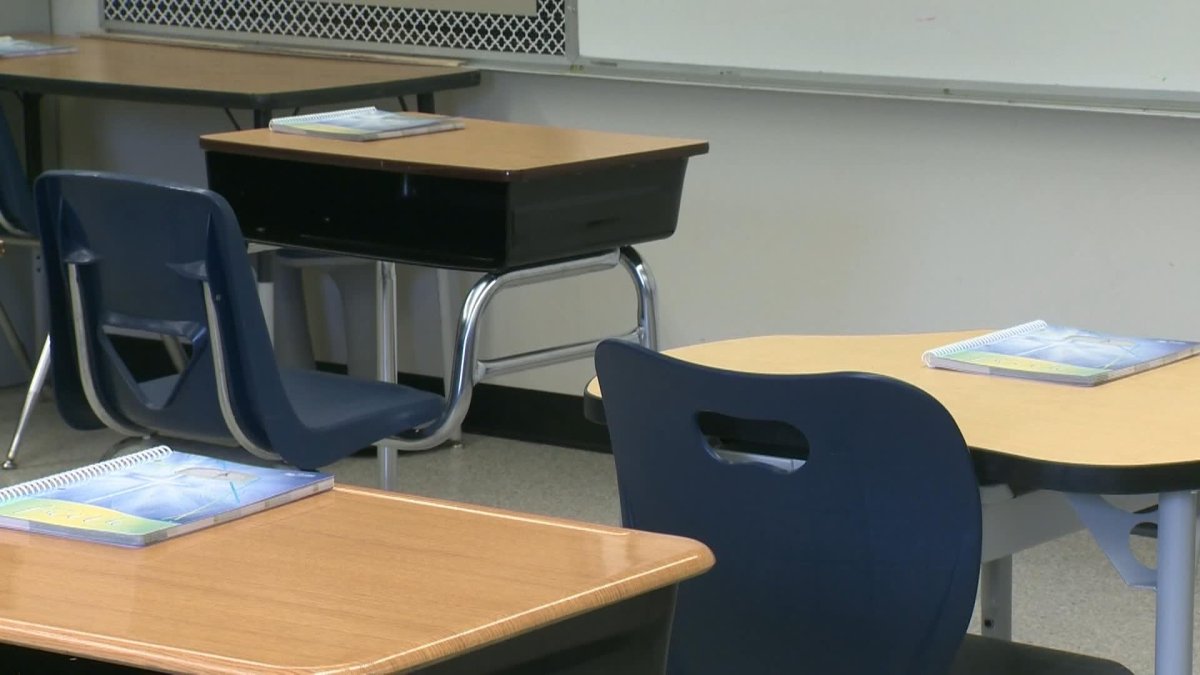 School desks sit empty in this file photo.