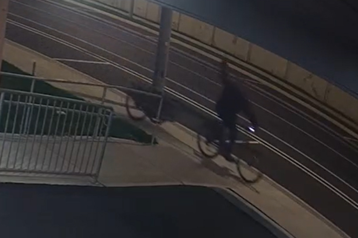 A video shows a man on a bike throwing an object at the pharmacy.