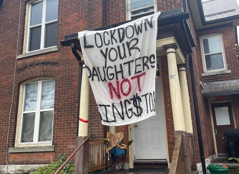 Queen's University said student who posted sexist signs from their University District homes over homecoming will face consequences. 