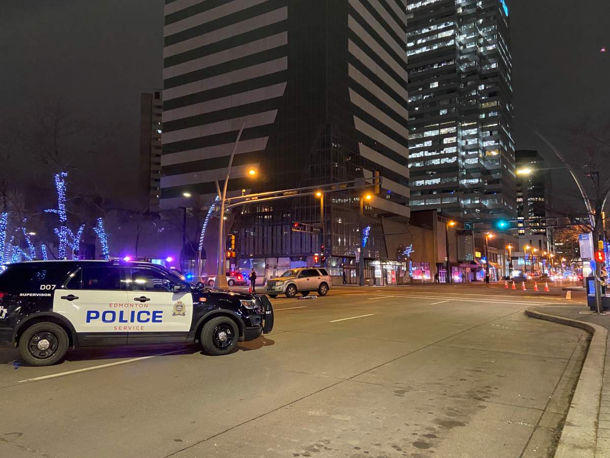 Edmonton police investigate a pedestrian collision on Jasper Ave and 101 Street on Tuesday, Nov. 30, 2021.