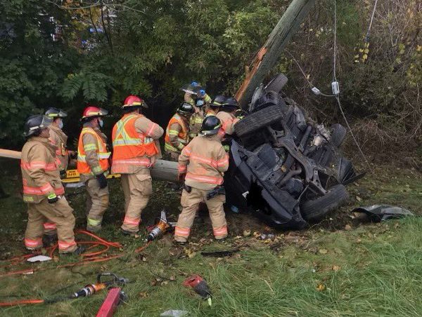 Fire crews work at the site of Thursday's two-vehicle collision on Highbury Avenue south of Hamilton Road. (Note: Image altered by LFD to remove license plate.).
