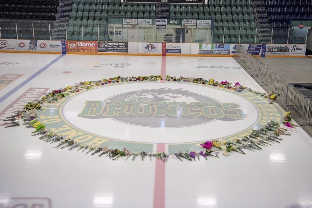 Flowers and other items in a memorial on centre ice at Elgar Petersen Arena in Humboldt, Sask., on Monday, April 9, 2018. 