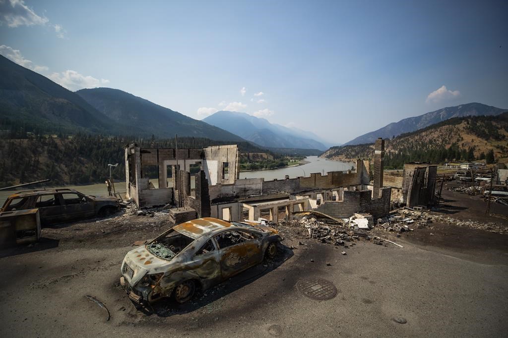 Burned cars and structures are seen in Lytton, B.C., on Friday, July 9, 2021, after a wildfire destroyed most of the village on June 30. THE CANADIAN PRESS/Darryl Dyck.