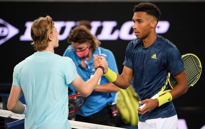 Canada's Felix Auger-Aliassime, right, is congratulated by compatriot Denis Shapovalov after winning their third round match at the Australian Open tennis championship in Melbourne, Australia on February 12, 2021.