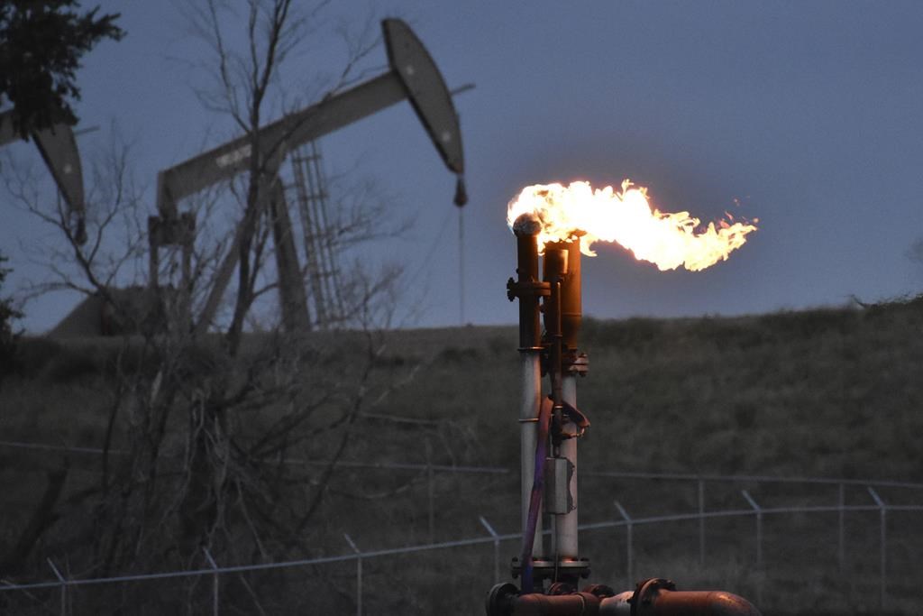 FILE - A flare to burn methane from oil production is seen on a well pad near Watford City, North Dakota, Aug. 26, 2021. The Ministry of Energy and Resources said the new initiatives will ensure Saskatchewan remains one of the most sustainable energy producers in the world.