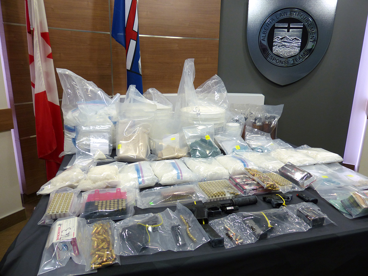 Firearms, ammunition and $1 million in drugs was seized during coordinated searches in Edmonton, Red Deer and Whitecourt earlier this month. 