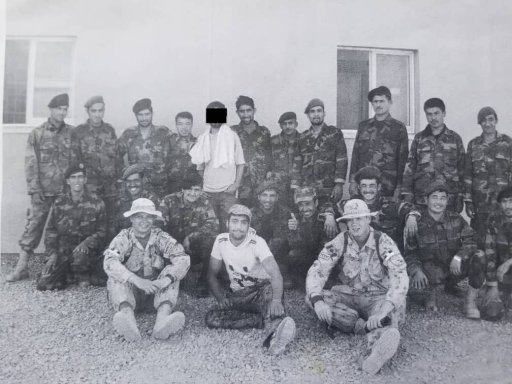 Abdul, centre with his face hidden to protect his identity, with the Canadian Forces in Kandahar.