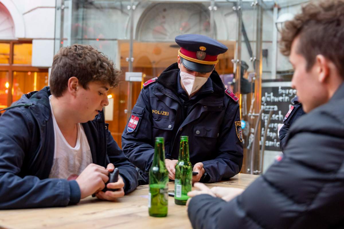 Austria police check for vaccination status during the country's unvaccinated lockdown.