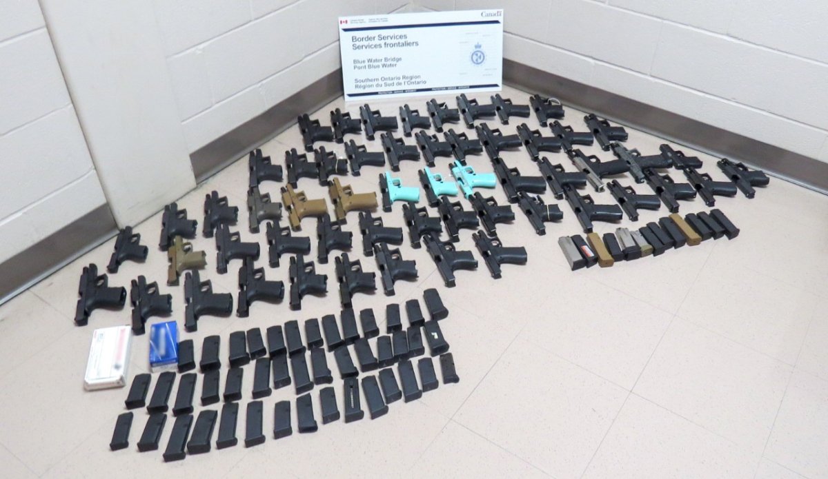 A collection of items from what the Canada Border Services Agency described as one of the largest single firearm seizures in the region's recent history. 