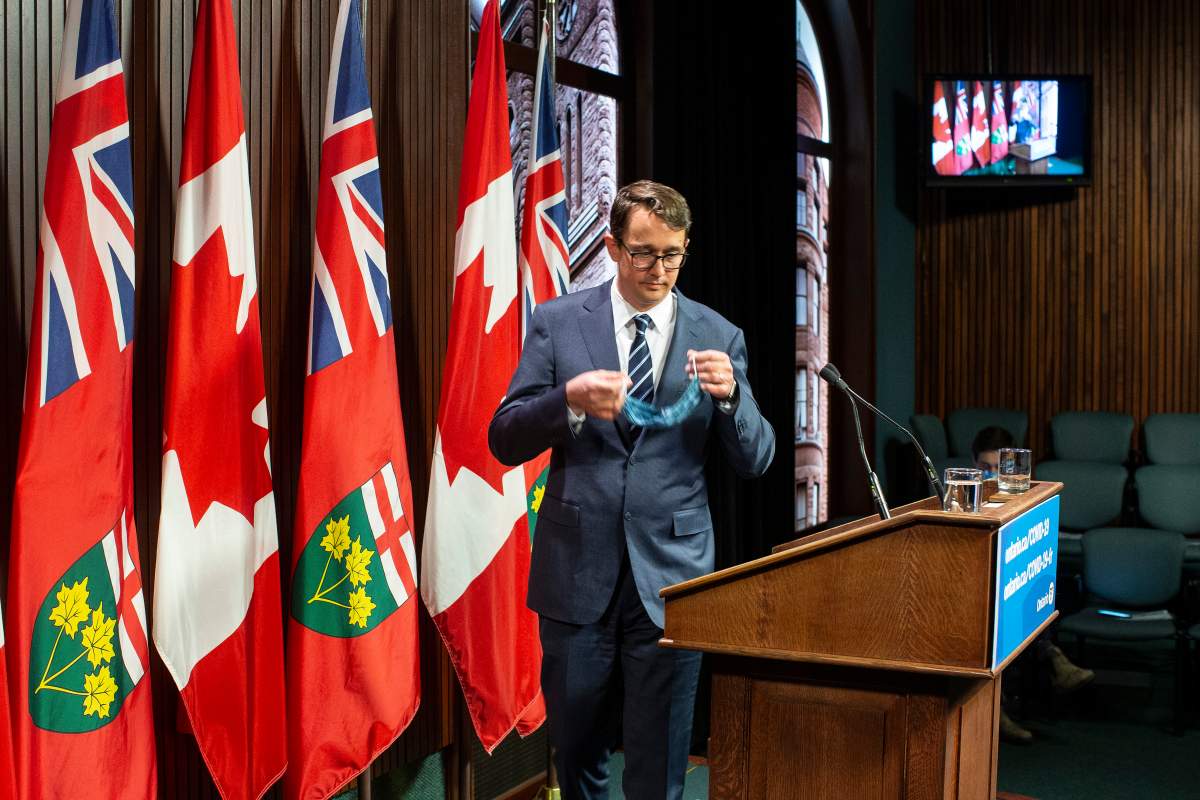 Ontario Labour Minister Monte McNaughton takes to the podium during a news conference in Toronto on Wednesday April 28, 2021.