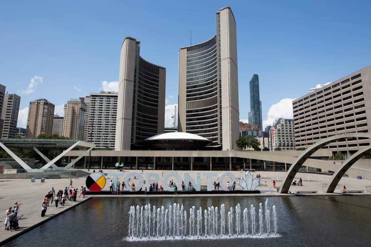Toronto City Hall by Nathan Phillips square in Toronto, Ont., on Sunday, July 29, 2018. THE CANADIAN PRESS IMAGES/Lars Hagberg.