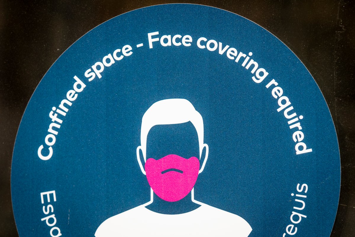 A poster encouraging mask wearing in a crowded space on Friday August 13, 2021.