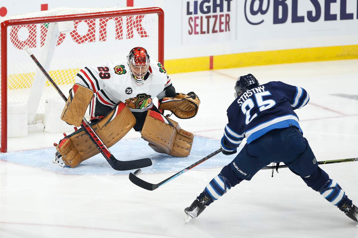 Winnipeg Jets’ Paul Stastny (25) scores on Chicago Blackhawks goaltender Marc-Andre Fleury (29) during first-period NHL action in Winnipeg on Friday, Nov. 5, 2021.