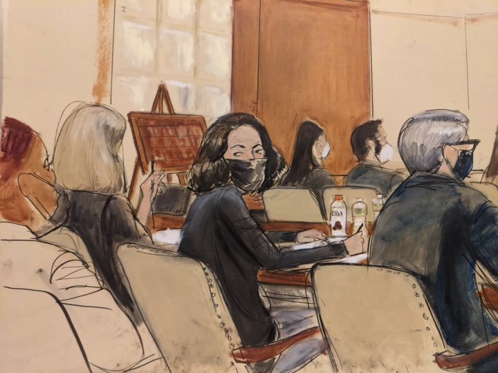 In this courtroom sketch, Ghislaine Maxwell looks over her shoulder to the courtroom audience prior to the start of jury selection in her trial, Tuesday, Nov. 16, 2021, in New York. Prospective jurors got their first glimpse of Maxwell, the British socialite charged with helping Jeffrey Epstein sexually abuse girls and women, when a judge began questioning them individually Tuesday. 