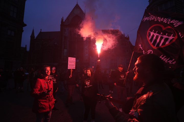 People take part in a demonstration against COVID-19 restrictions in Amsterdam, Netherlands, Saturday, Nov. 20, 2021.