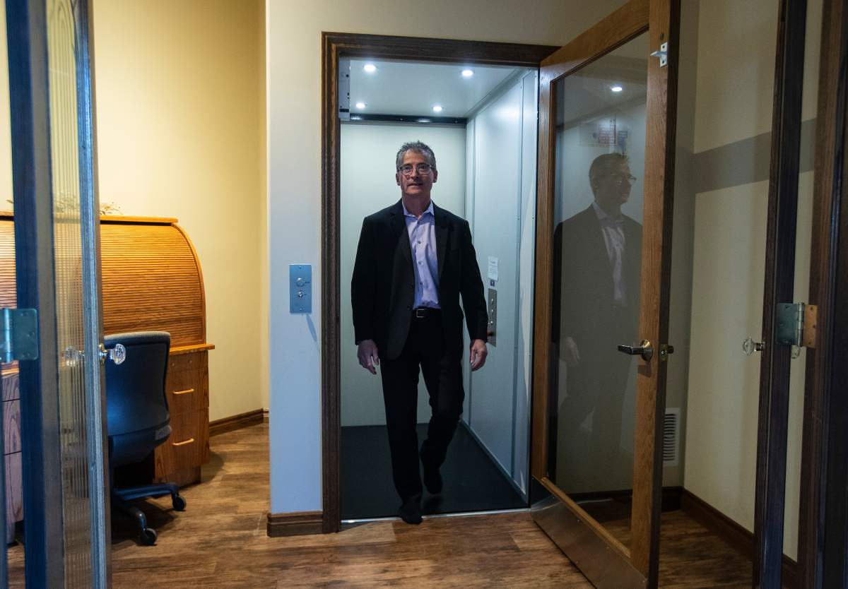 Real estate agent, Brian Cyr walks out of an elevator to the basement of what is considered the gold standard of homes for people with disabilities, in St. Albert, Alta., on Thursday November 4, 2021.