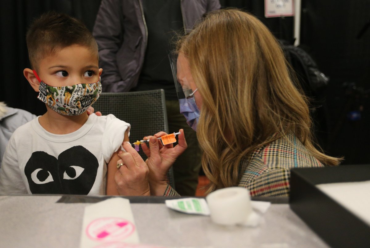 Children who are part of the Hospital for Sick Children family between the ages of 5 and 11 years of age are some of the first to get vaccinated for COVID-19 at the Metro Toronto Convention Centre, in Toronto, Tuesday, Nov. 23, 2021. 