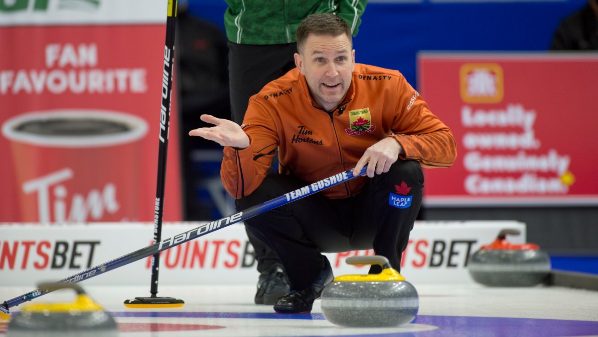 Skip Brad Gushue of St.John's N.L. discusses a shot with his team during draw 10 against team Dunstone at the Tim Hortons Curling Trials in Saskatoon on Nov. 24, 2021.