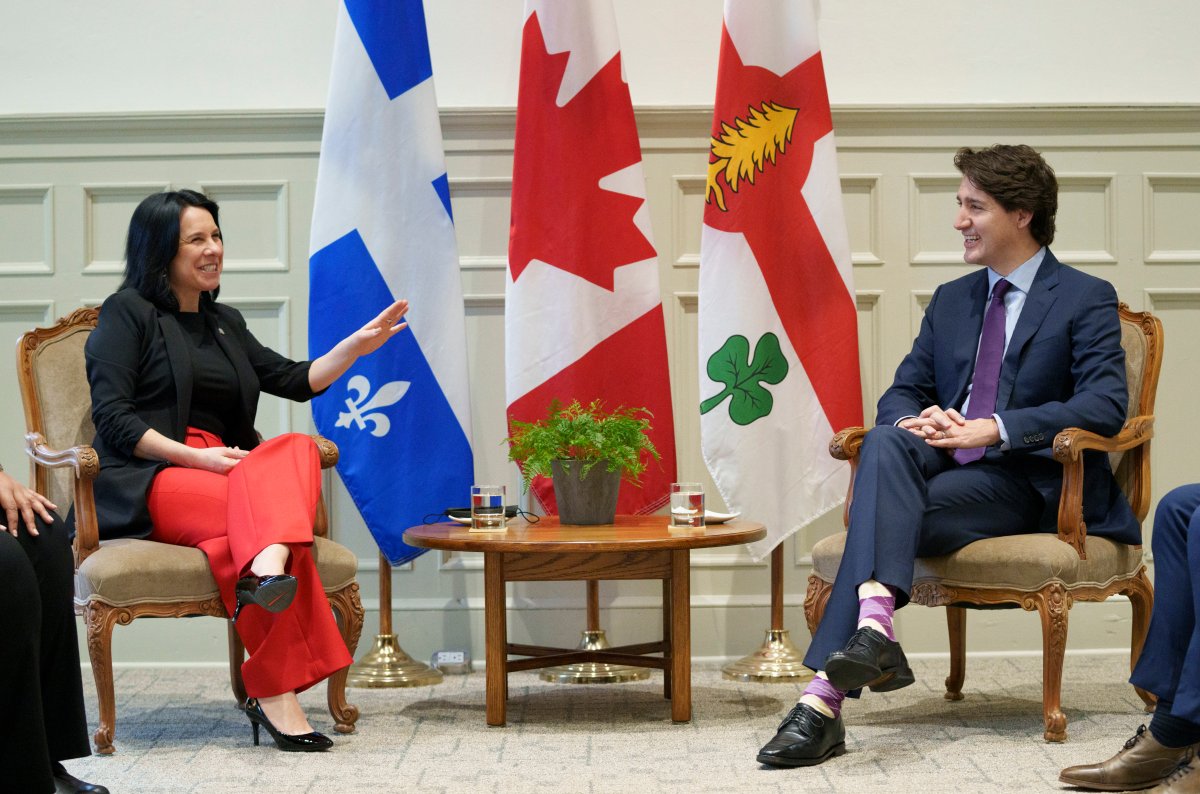 Montreal Mayor Valerie Plante chats with Prime Minister Justin Trudeau prior to a meeting at City Hall in Montreal on Friday, November 26, 2021. 