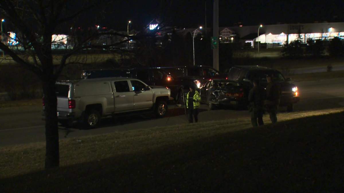 Edmonton police investigating a crash involving a stolen Infiniti G35 car and several other police vehicles on the ramp to Whitemud Drive westbound near the intersection with Calgary Trail early on Monday, Nov. 8, 2021.