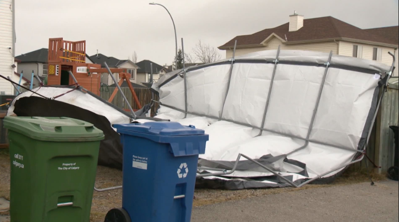 Strong winds in Calgary appear to have blown a carport into a neighbouring yard in Taradale Nov. 16, 2021.