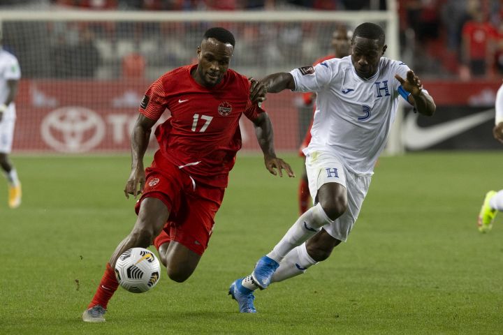 Canada's Cyle Larin (left) takes on Honduras' Maynor Figueroa during second half World Cup qualifying action in Toronto on Thursday, September 2, 2021. 