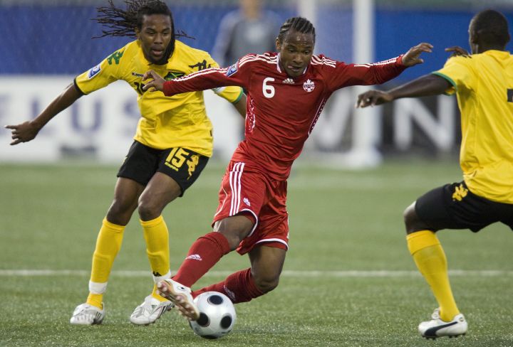 Canada's midfielder Julian de Guzman (6) weaves his way through Jamaica's Ricardo Gardner (15) and Evan Taylor (right) during first half FIFA World Cup qualifying action in Toronto on Wednesday August 20, 2008.  