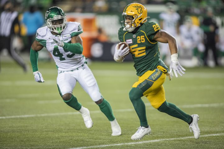Saskatchewan Roughriders’ Deon Lacey (45) chases Edmonton Elks’ Walter Fletcher (25) during first half CFL action in Edmonton on Friday, November 5, 2021.