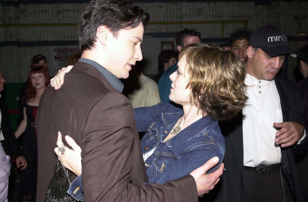 Keanu Reeves and Winona Ryder share a hug at the 2000 MTV Movie Awards.