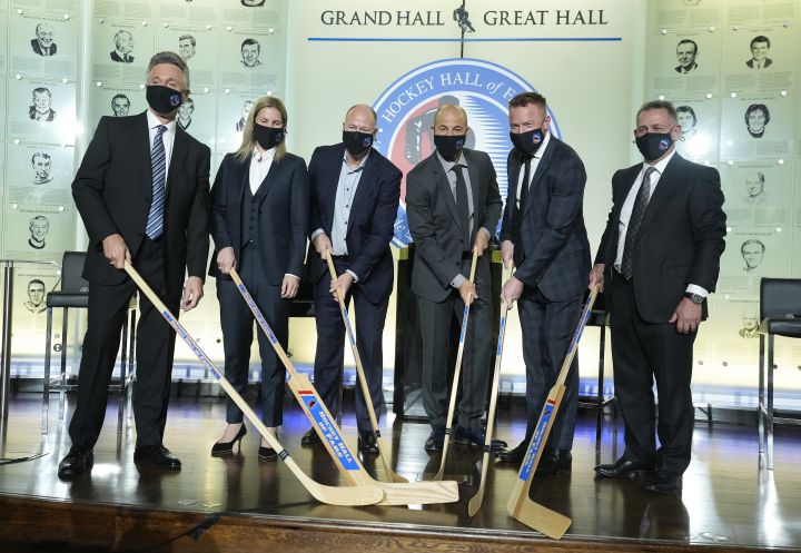 Hockey Hall of Fame inductees, left to right, Doug Wilson, Kim St-Pierre, Kevin Lowe, Jarome Iginla, Marian Hossa and Ken Holland pose for a photograph in Toronto, Friday, Nov. 12, 2021. 