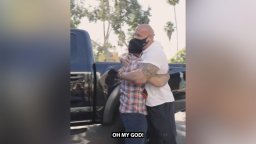 Dwayne Johnson is seen embracing a veteran after giving him his own personal truck