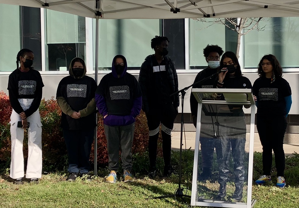 Members of Hamilton Students For Justice present the findings of the Community Safety and Well-Being Action Plan for Black Youth in Hamilton Schools outside of the HWDSB headquarters on Wednesday morning.