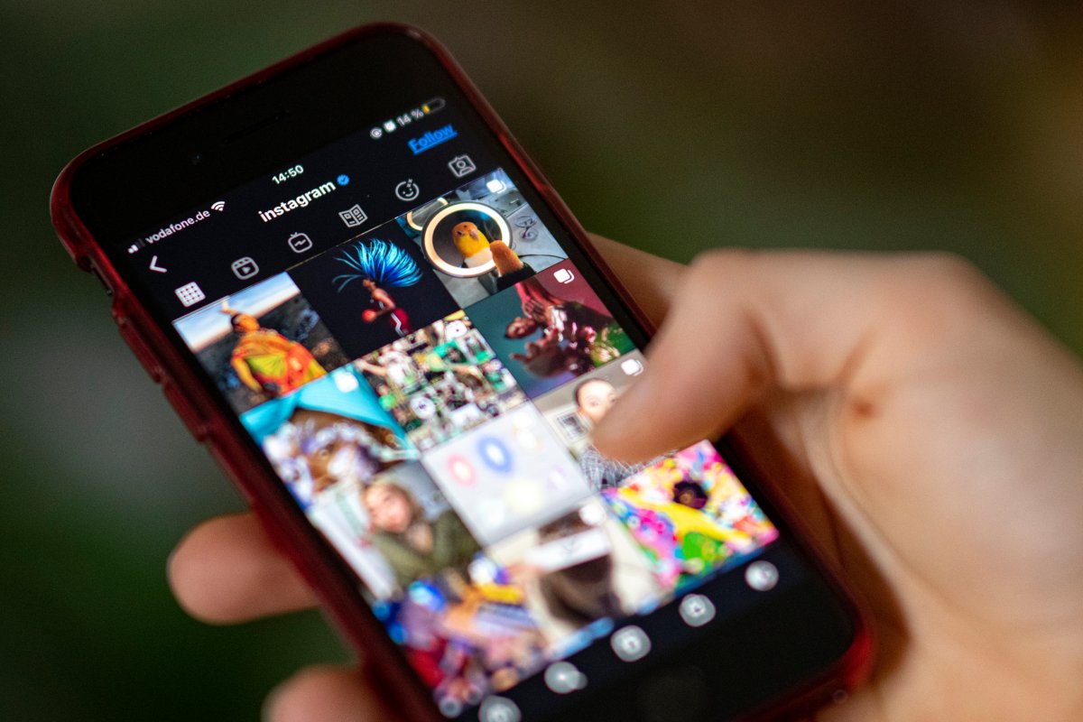 A user scrolls through their Instagram feed showing several posts on the social media app.
