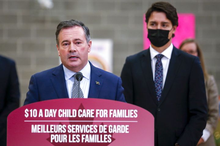 Prime Minister Justin Trudeau, right, looks on as as Alberta Premier Jason Kenney makes a child care announcement in Edmonton, Alta., Monday, Nov. 15, 2021.