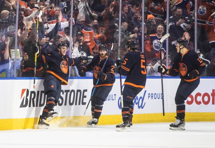 Edmonton Oilers’ Connor McDavid (97), Duncan Keith (2), Cody Ceci (5) and Jesse Puljujarvi (13) celebrate a goal against the Winnipeg Jets during third period NHL action in Edmonton on Thursday, November 18, 2021.