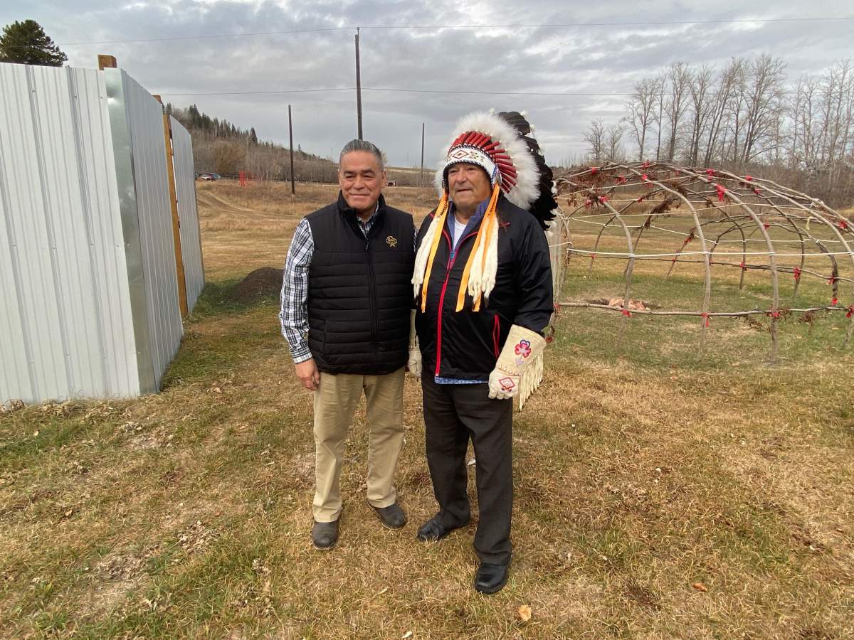 Lewis Cardinal of the Indigenous Knowledge and Wisdom Centre and Elder Howard Mustus stand on the kihciy askiy project site, Nov. 5, 2021.