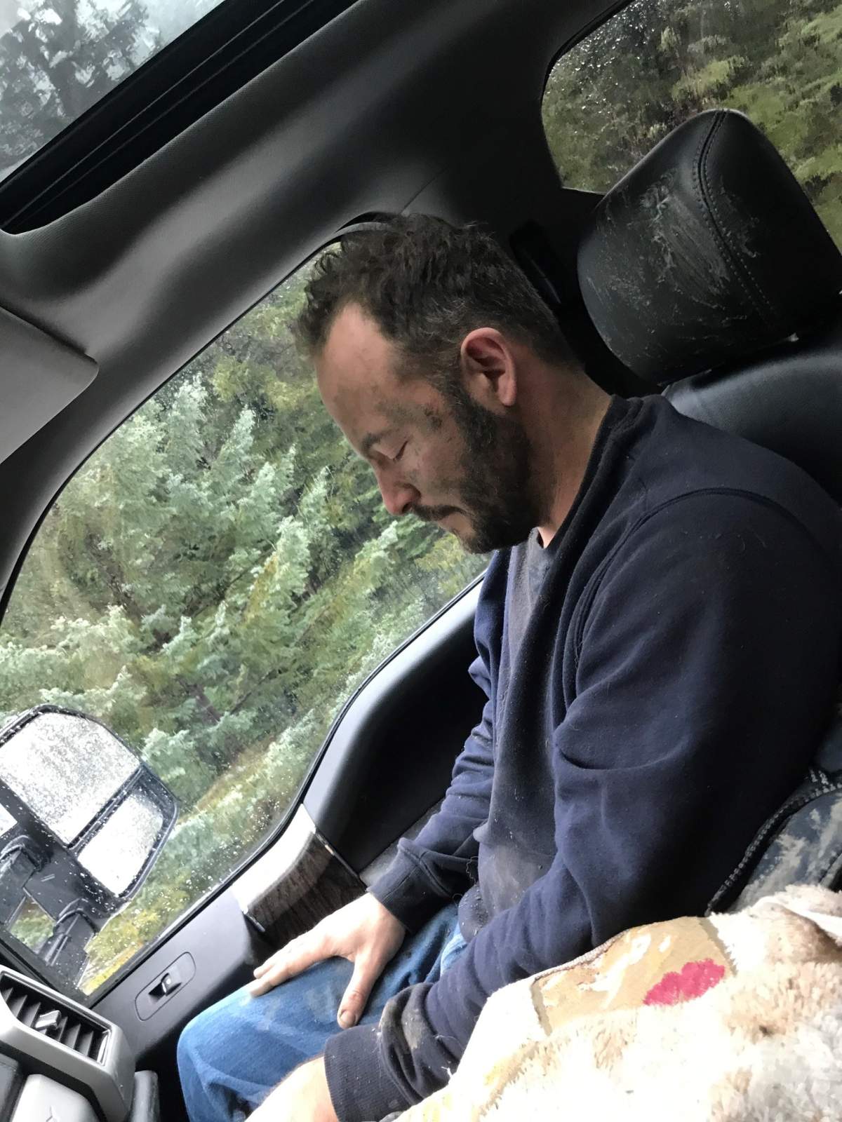 Noah Morse in Good Samaritan Kathie Rennie’s vehicle after she gave him some clothes to wear following a Nov. 15 mudslide near Lillooet.