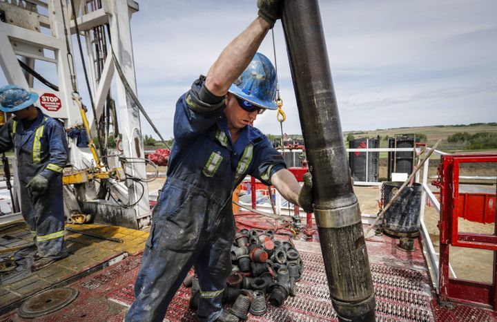 A crew on an oil rig drills for oil near Clive, Alta., Wednesday, June 5, 2019. 