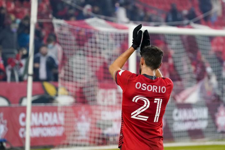 Toronto FC midfielder Jonathan Osorio (21) salutes the fans after defeating Pacific FC in Canadian Championship semifinal action in Toronto on Wednesday, November 3, 2021.