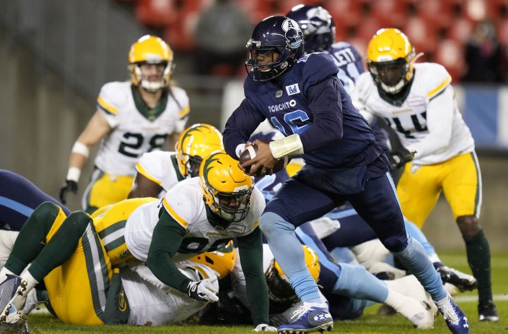 Toronto Argonauts quarterback Antonio Pipkin (16) runs the ball in for a touchdown against the Edmonton Elks during first half CFL football action in Toronto, Tuesday, Nov. 16, 2021.