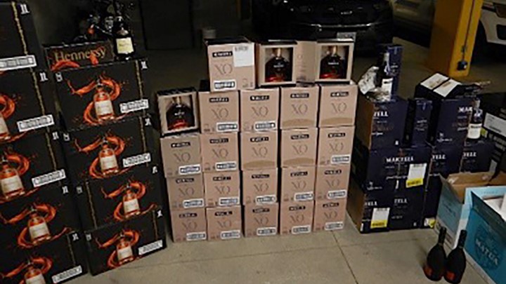 A police photo showing cases of alcohol that was seized from a minivan late last month.
