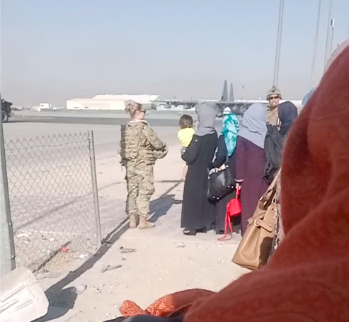 Fatimah’s family waiting to board evacuation flight at Kabul airport, Aug. 25, 2021.