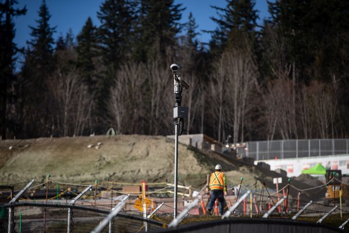 Security cameras are used to monitor the double-fenced perimeter as work continues on the Trans Mountain Pipeline expansion project at the company's Burnaby Terminal tank farm in Burnaby, B.C., on Wednesday, March 10, 2021. 